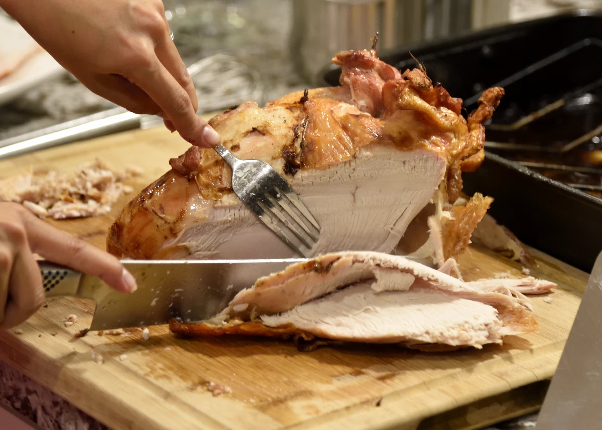 Roast turkey being carved on a board
