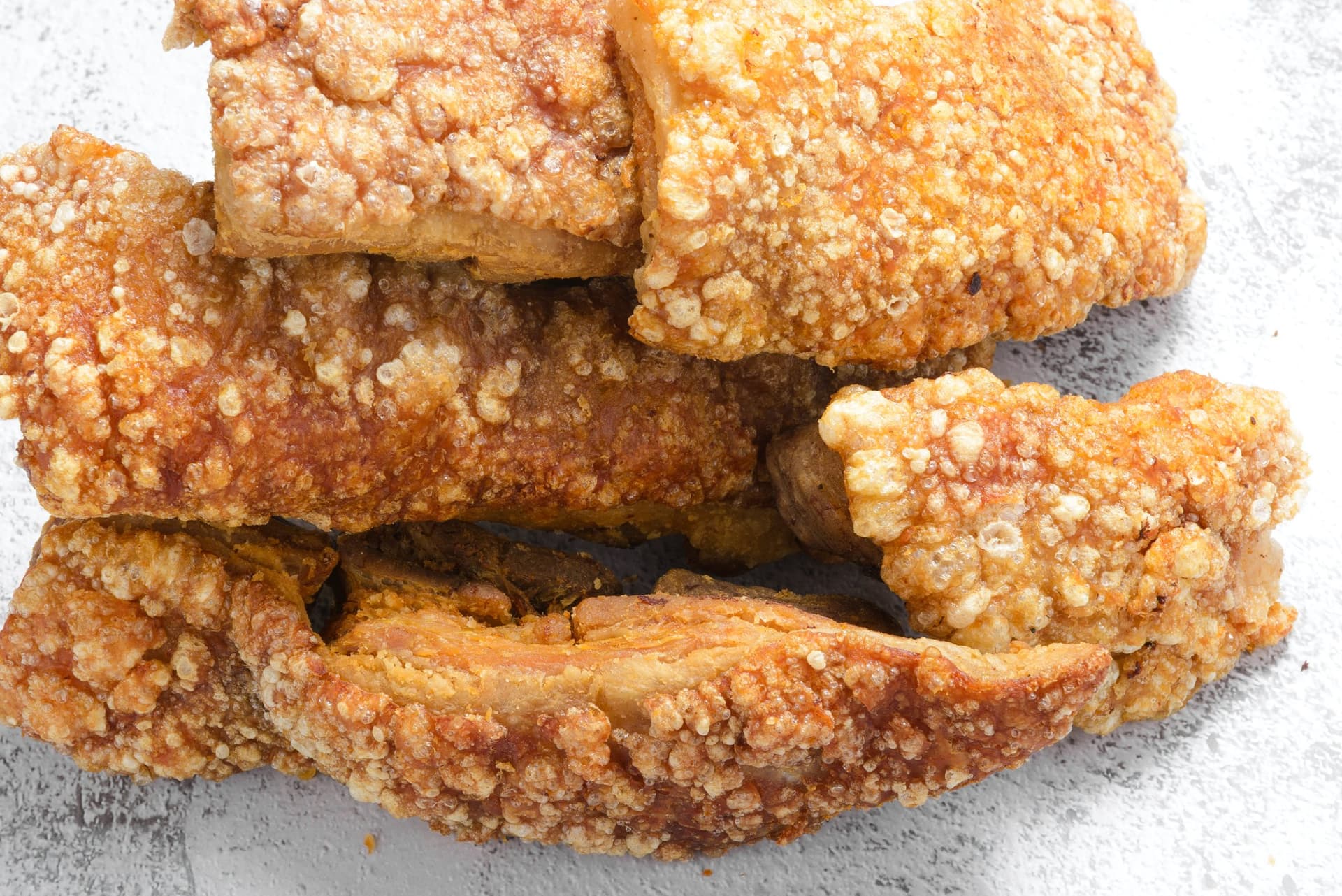 Pieces of golden pork crackling